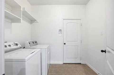 a view of a room with cabinet and a window