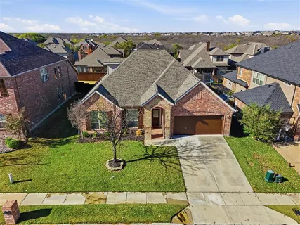 an aerial view of a house with swimming pool