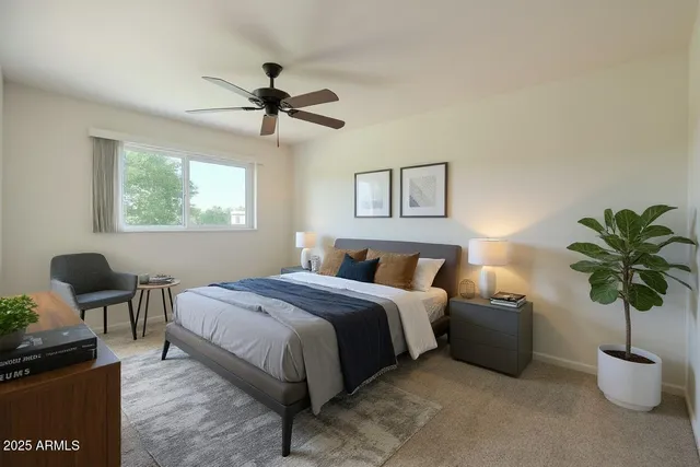 a bedroom with a bed and a potted plant