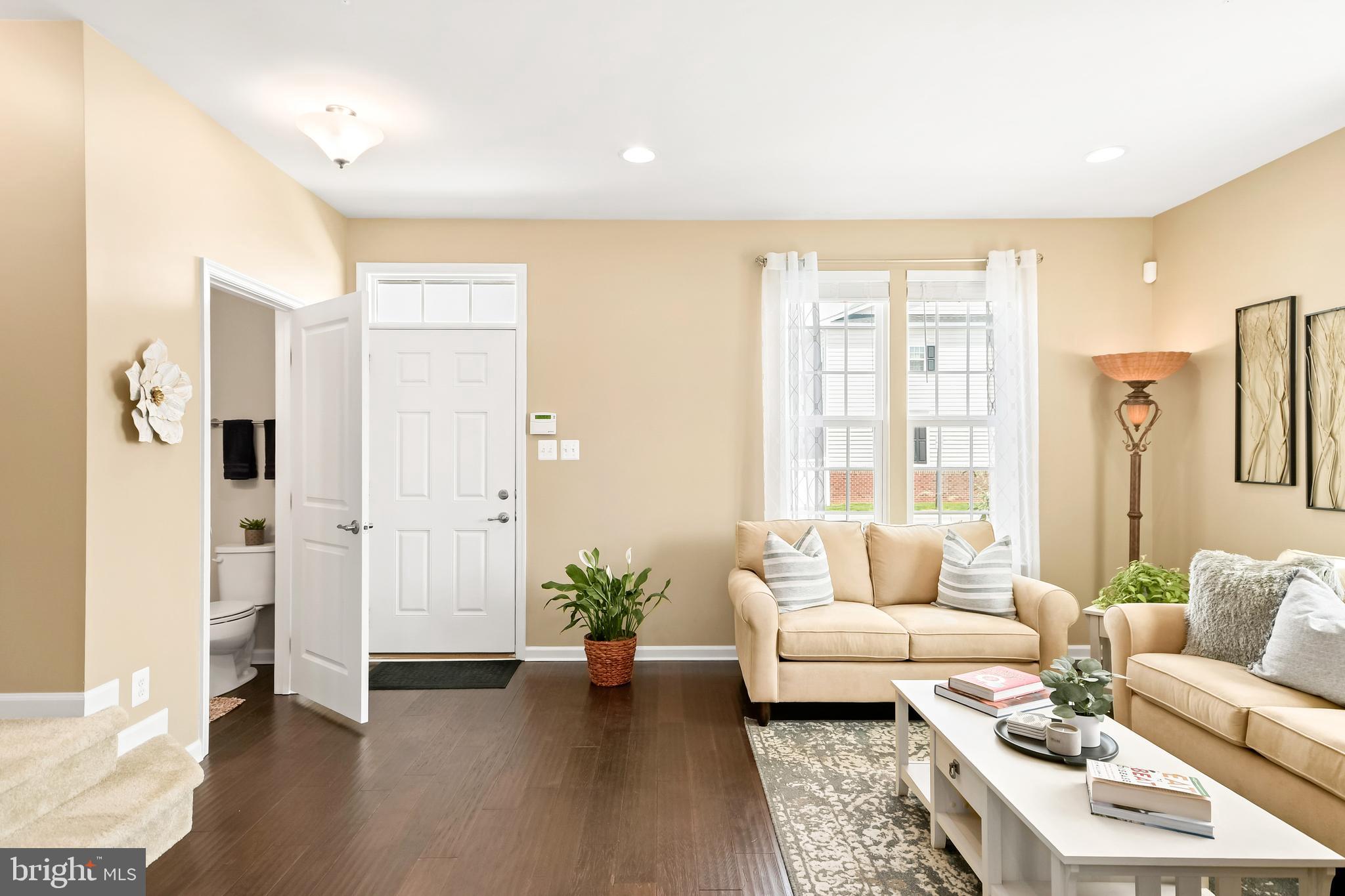 4502 Tinder Monrovia, MD 21770 - Photo 20 of 62 a living room with furniture and wooden floor
