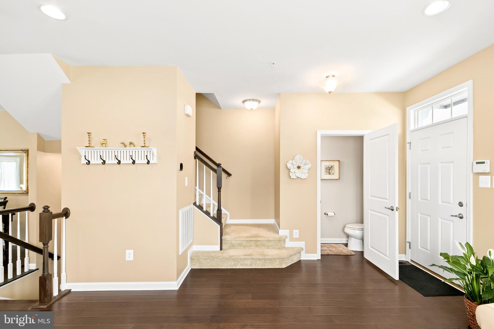 4502 Tinder Monrovia, MD 21770 - Photo 21 of 62 a view of front door with hallway and wooden floor