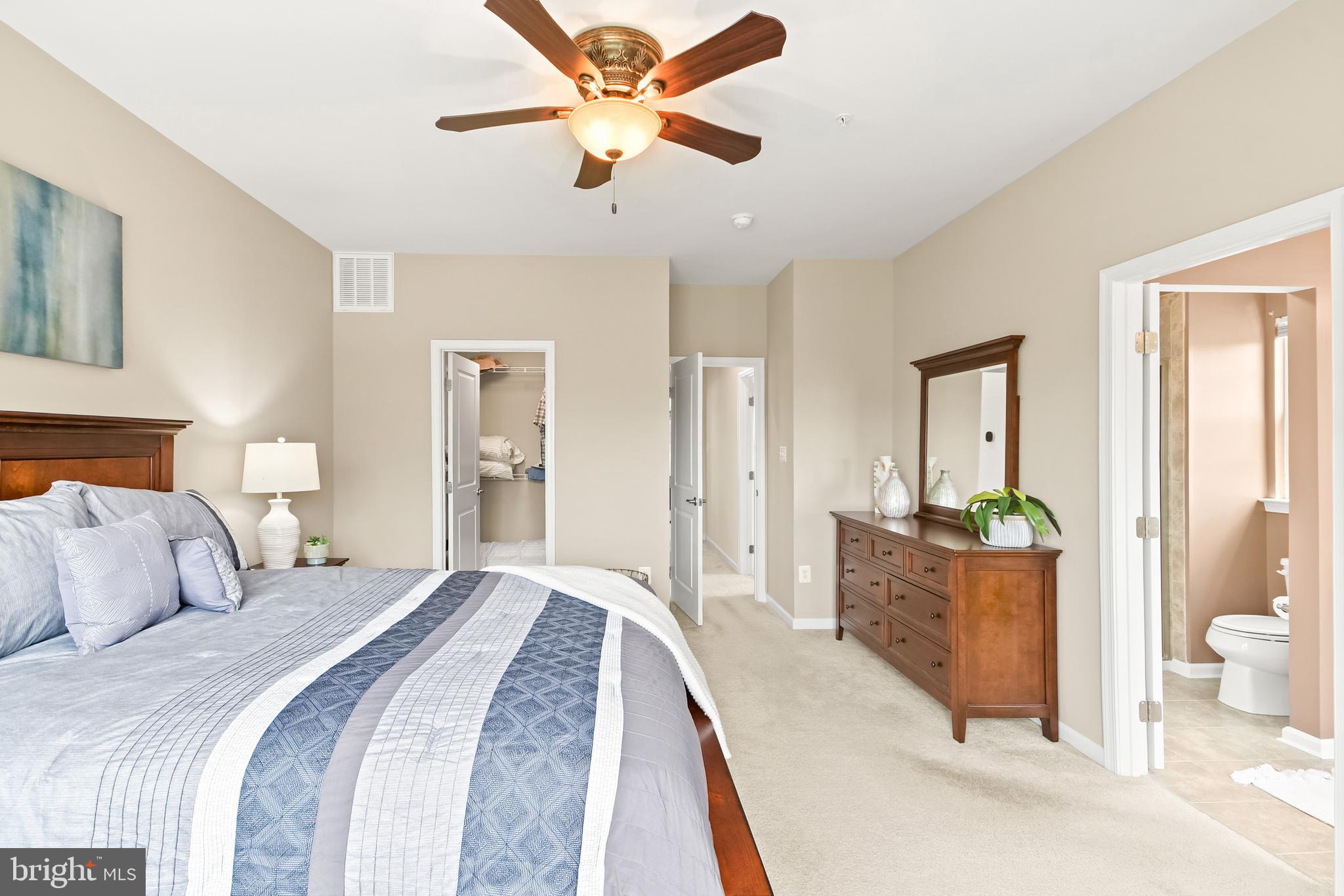 4502 Tinder Monrovia, MD 21770 - Photo 39 of 62 a bedroom with a bed and glass walk in closet