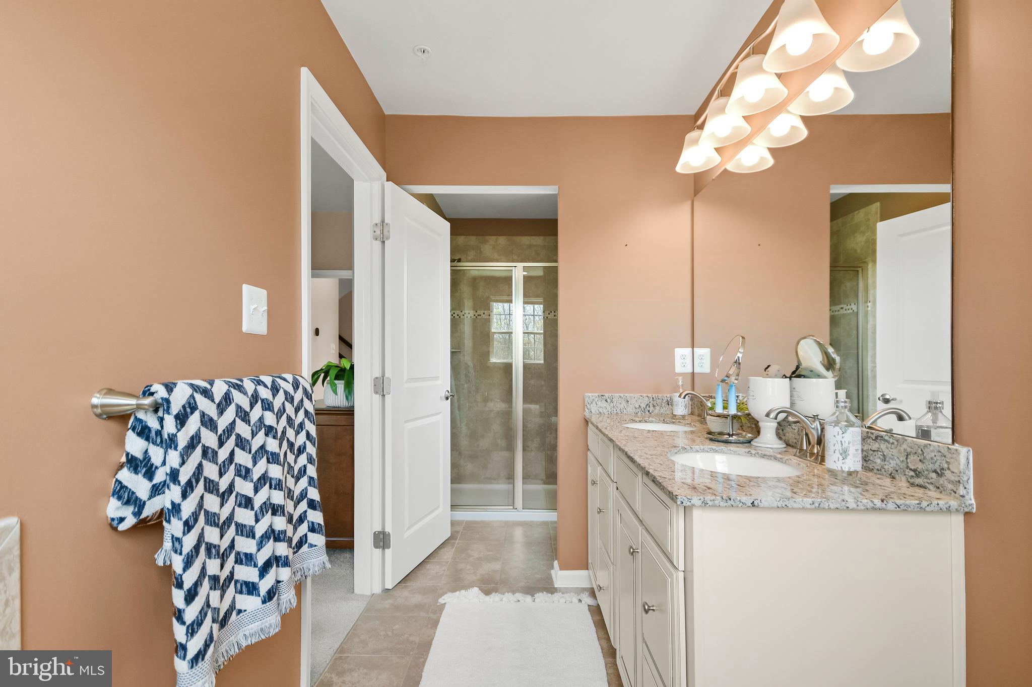 4502 Tinder Monrovia, MD 21770 - Photo 41 of 62 a bathroom with a sink vanity granite and a mirror