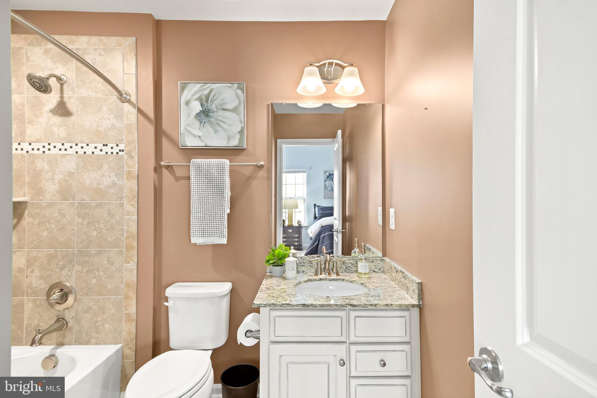 4502 Tinder Monrovia, MD 21770 - Photo 46 of 62 a bathroom with a granite countertop sink and a mirror
