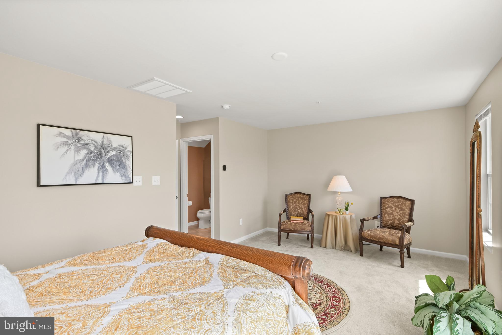 4502 Tinder Monrovia, MD 21770 - Photo 48 of 62 a bedroom with a bed and a chandelier