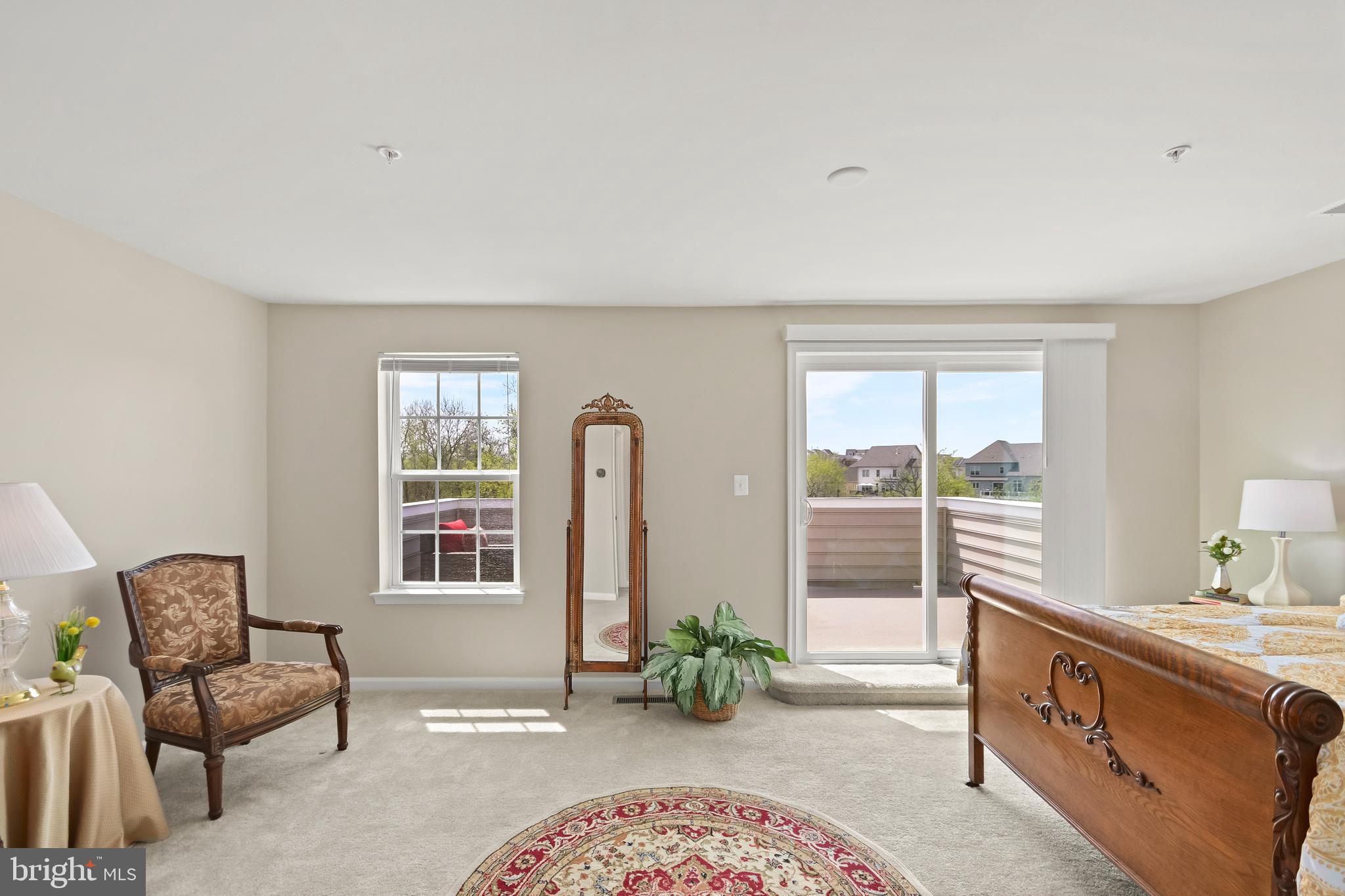 4502 Tinder Monrovia, MD 21770 - Photo 49 of 62 a spacious bedroom with a balcony a bed and a window