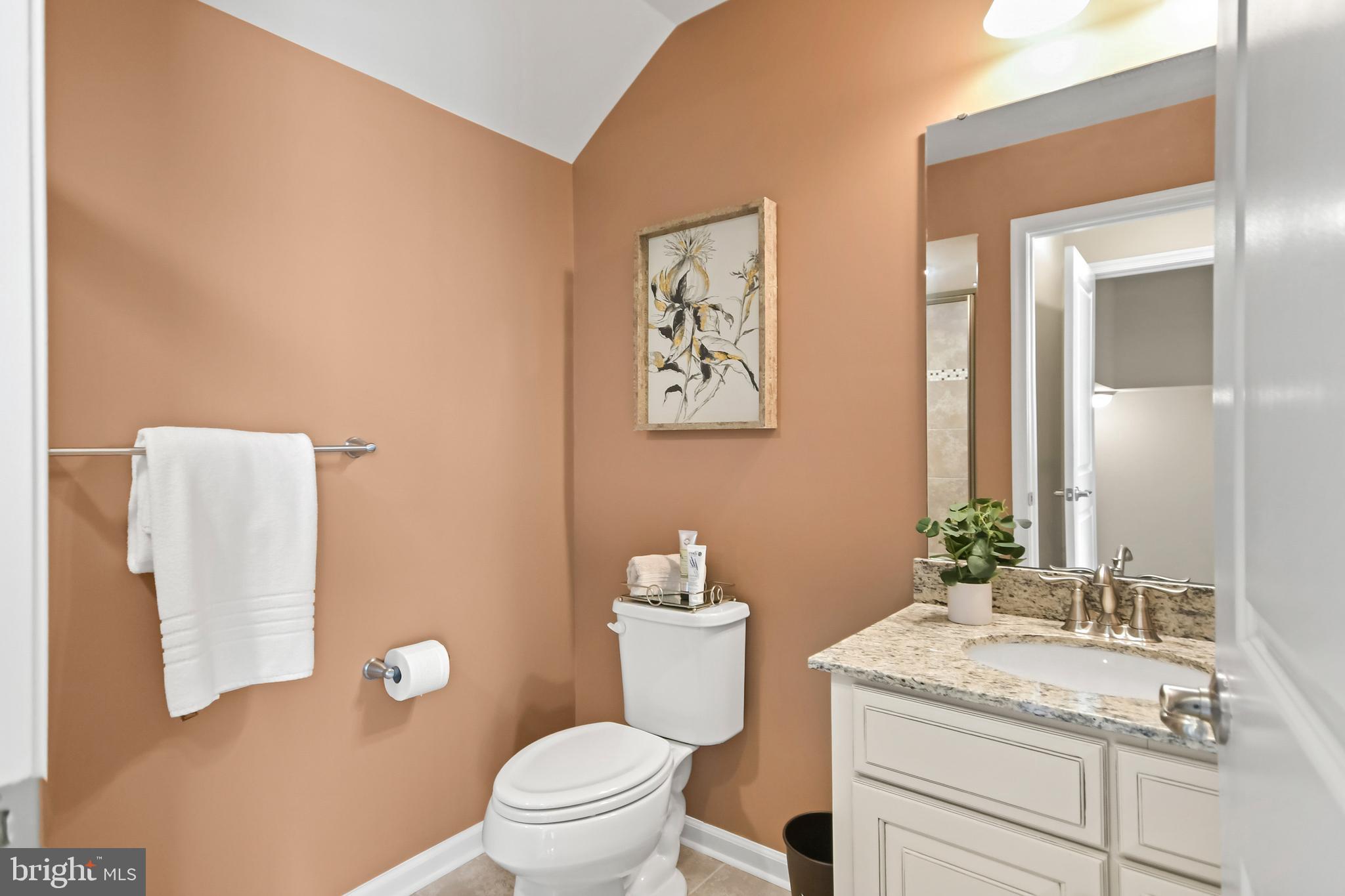 4502 Tinder Monrovia, MD 21770 - Photo 50 of 62 a bathroom with a granite countertop toilet sink and mirror