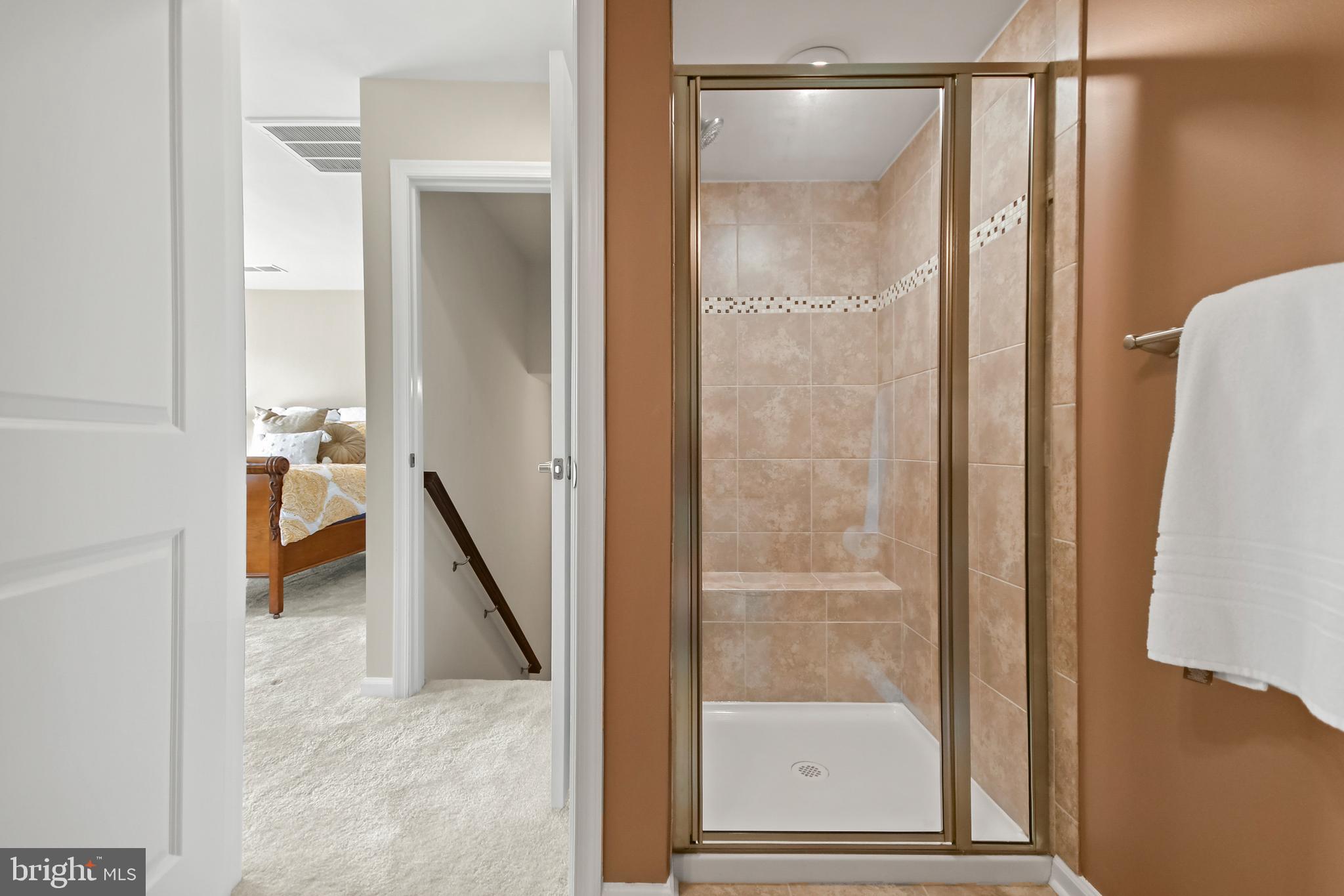 4502 Tinder Monrovia, MD 21770 - Photo 51 of 62 a bathroom with a glass shower door and a mirror