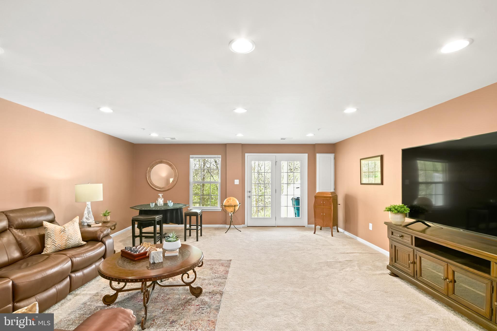 4502 Tinder Monrovia, MD 21770 - Photo 55 of 62 a living room with furniture and a flat screen tv