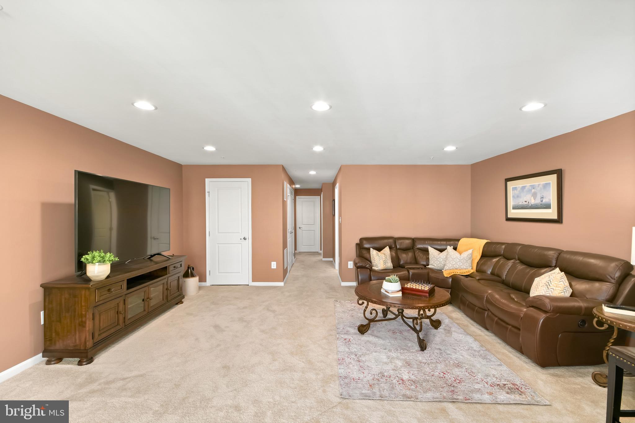 4502 Tinder Monrovia, MD 21770 - Photo 56 of 62 a living room with furniture and a flat screen tv