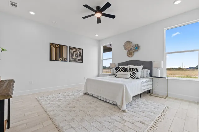 a bathroom with a double vanity sink mirror and shower