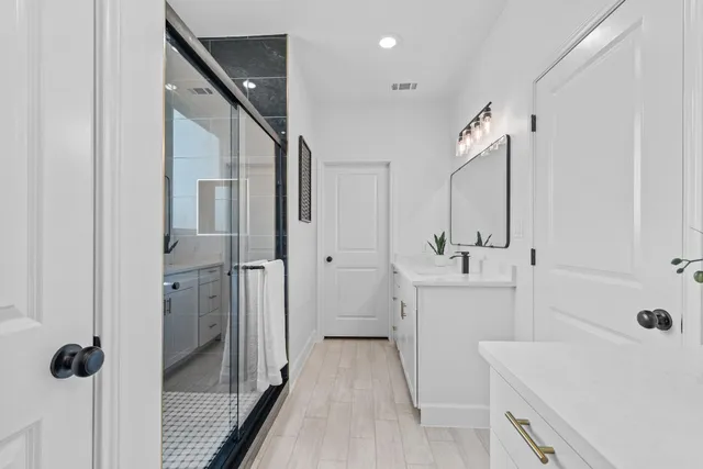 a bathroom with a sink and shower