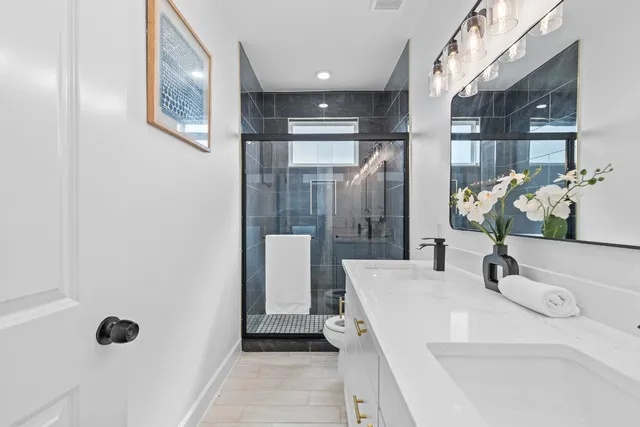 an empty room with a window and a ceiling fan