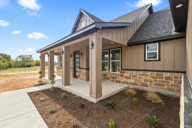 a front view of a house with a porch