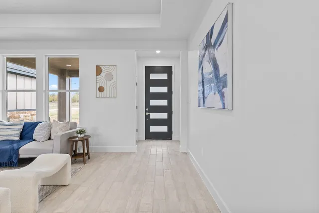 a view of a livingroom with furniture and entryway