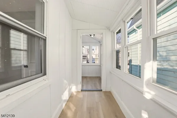 a view of a hallway with a window