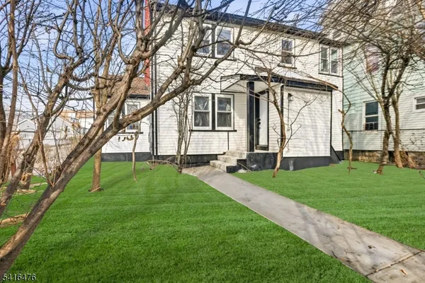 a house view with a garden space