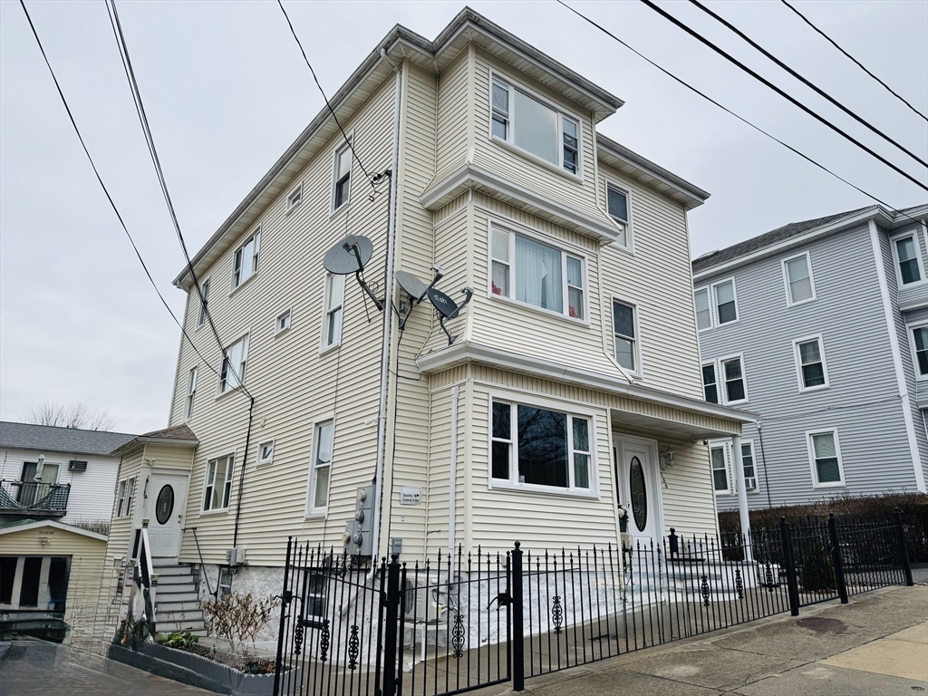 a front view of a house with glass windows