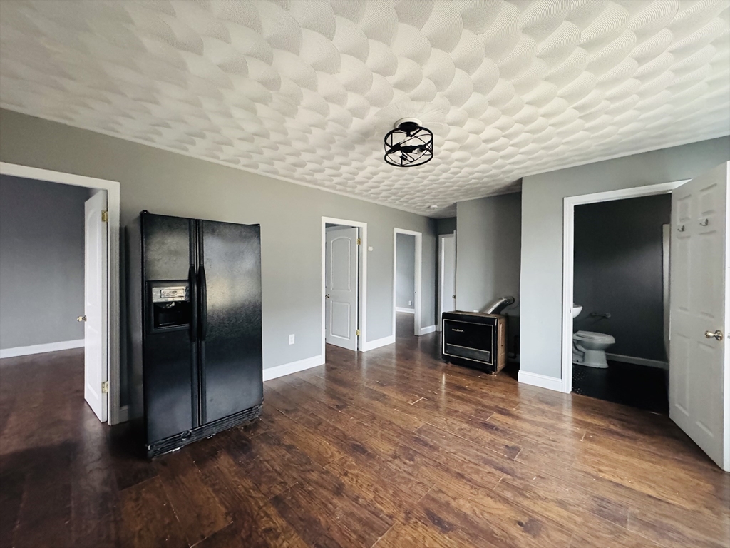 166 Bradford Avenue, Unit 3 Fall River, MA 02721 - Photo 5 of 19 a view of a livingroom with wooden floor