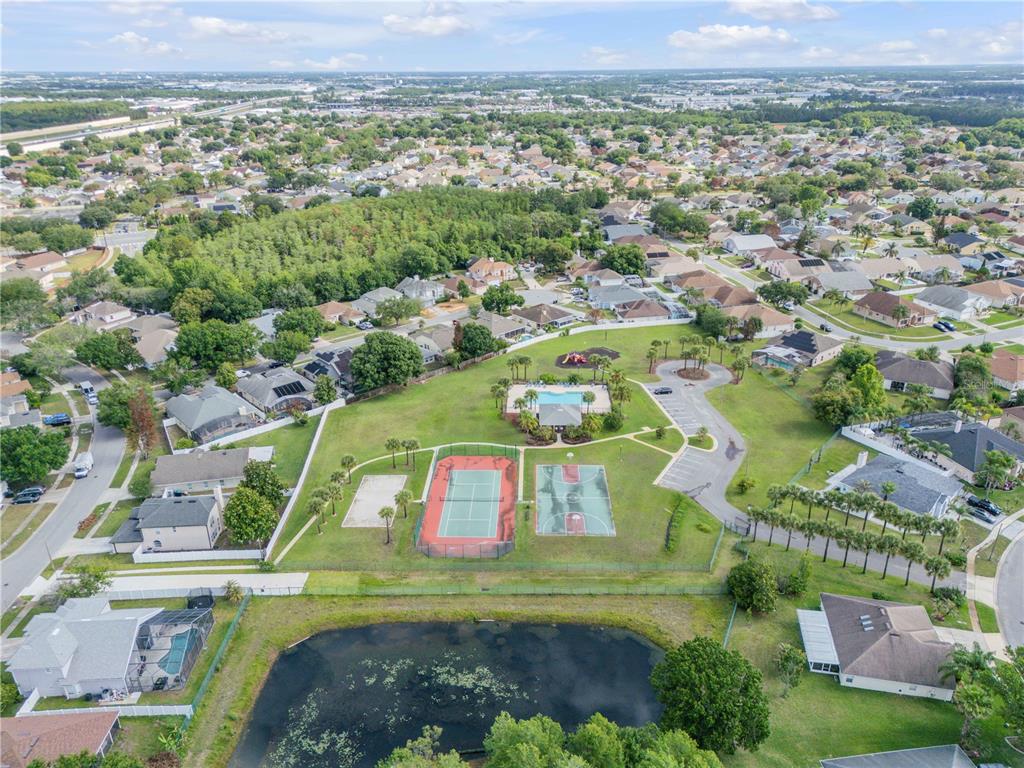 12232 Bronson Way Orlando, FL 32824 - Photo 31 of 32 an aerial view of residential houses with outdoor space and pool