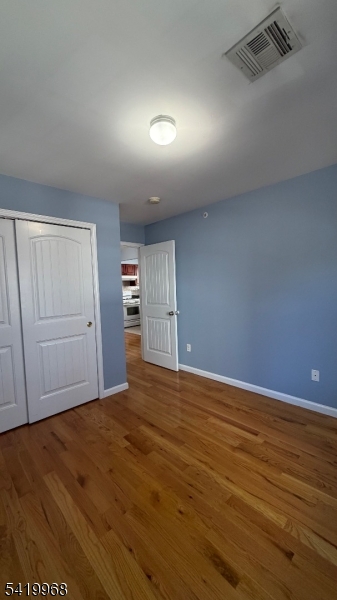 159 Lafayette Street, Unit 3 Newark, NJ 07105 - Photo 13 of 17 a view of empty room with wooden floor