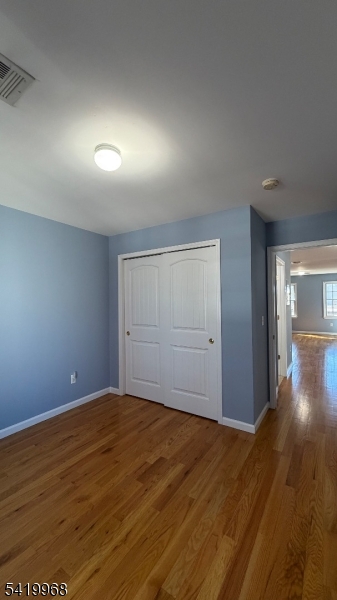 159 Lafayette Street, Unit 3 Newark, NJ 07105 - Photo 14 of 17 a view of an empty room and wooden floor