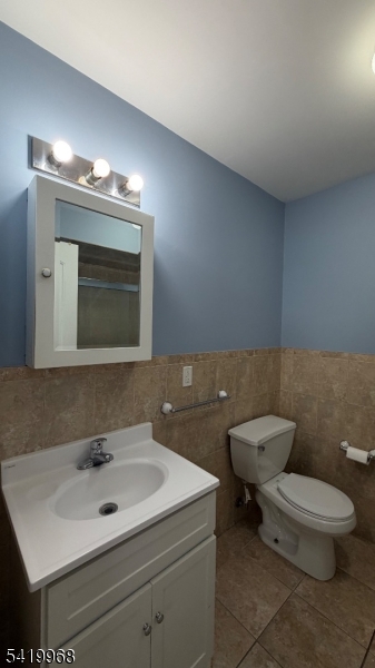 159 Lafayette Street, Unit 3 Newark, NJ 07105 - Photo 9 of 17 a bathroom with a toilet sink and mirror