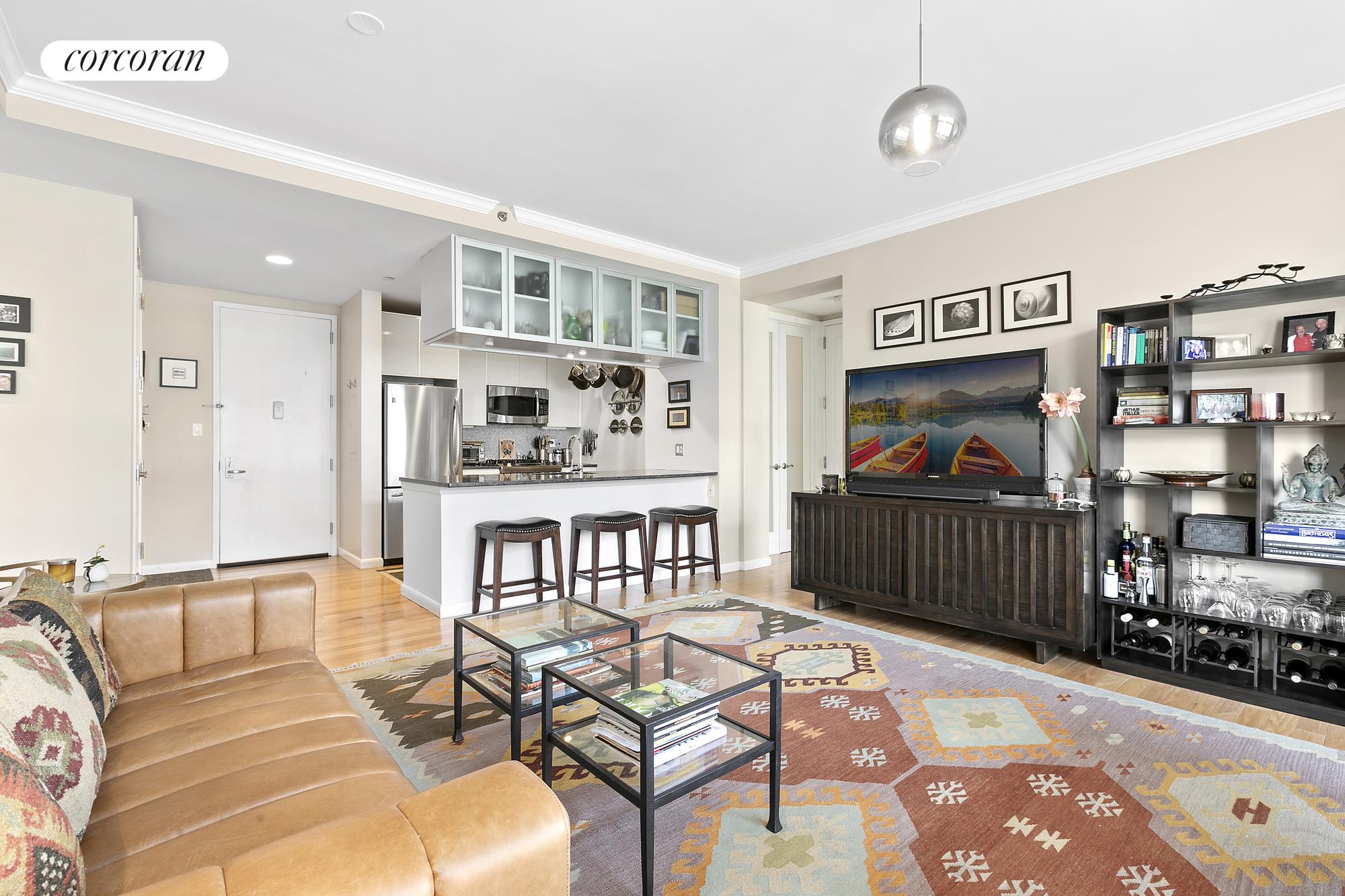 a living room with furniture a rug and a chandelier