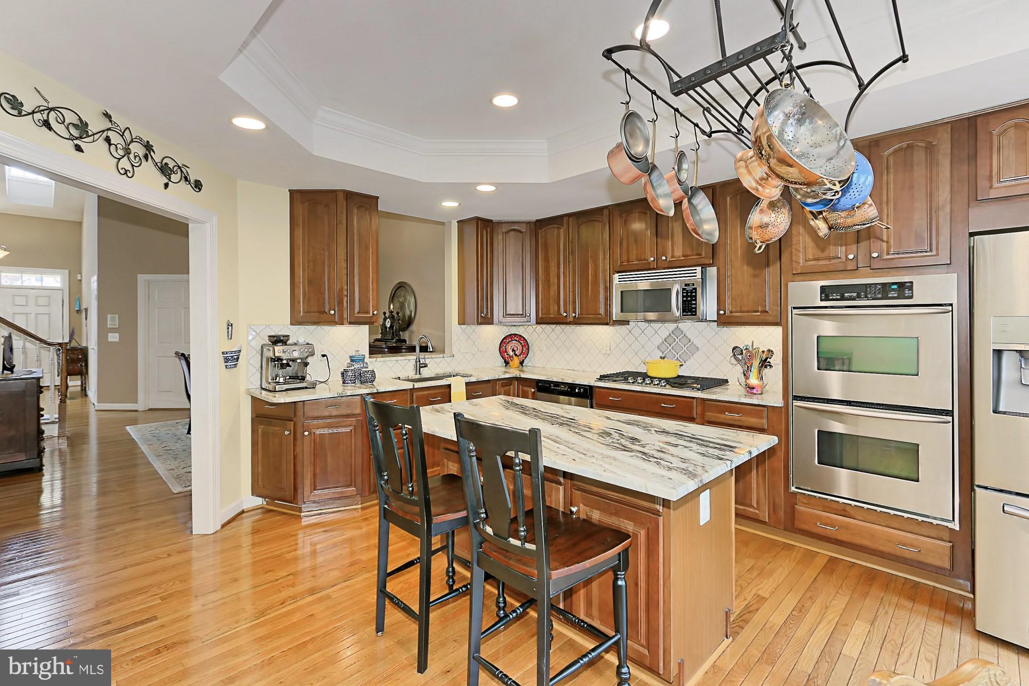 7357 Cluster House Way Gainesville, VA 20155 - Photo 4 of 46 With brand new Whirlpool 5-Burner Gas Cooktop