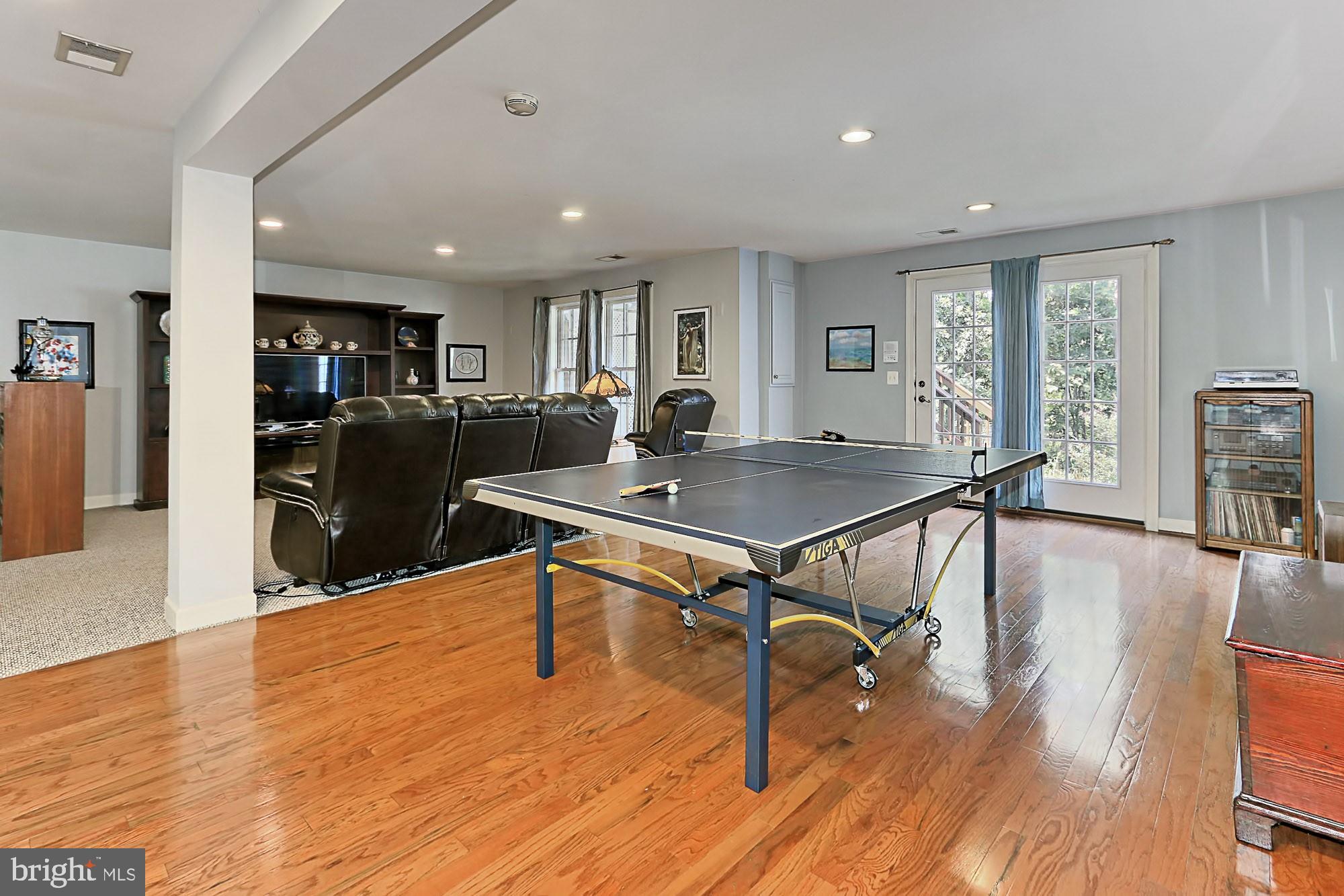 7357 Cluster House Way Gainesville, VA 20155 - Photo 34 of 46 Hardwood alongside carpeted family room nook