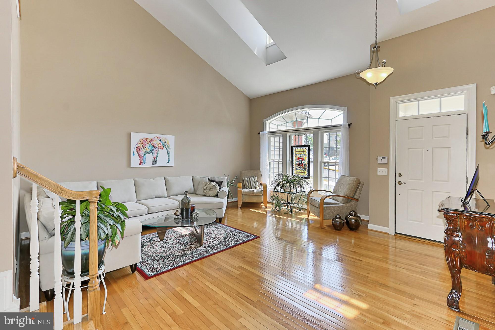 7357 Cluster House Way Gainesville, VA 20155 - Photo 8 of 46 Light-Filled Skylight Dormers & Transom Windows