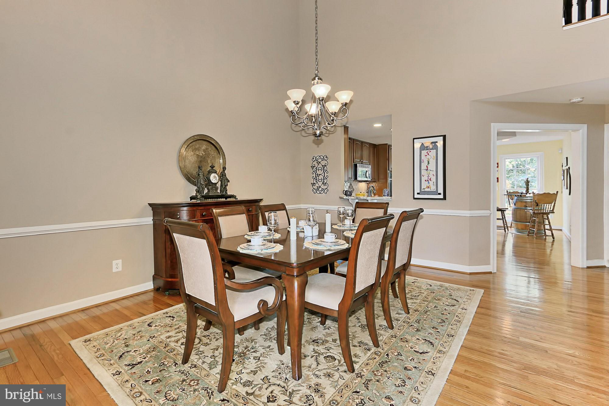 7357 Cluster House Way Gainesville, VA 20155 - Photo 10 of 46 Impressive Oversized Dining Room w/ 20+' Ceilings