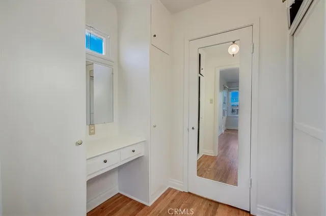 a bathroom with a shower and mirror