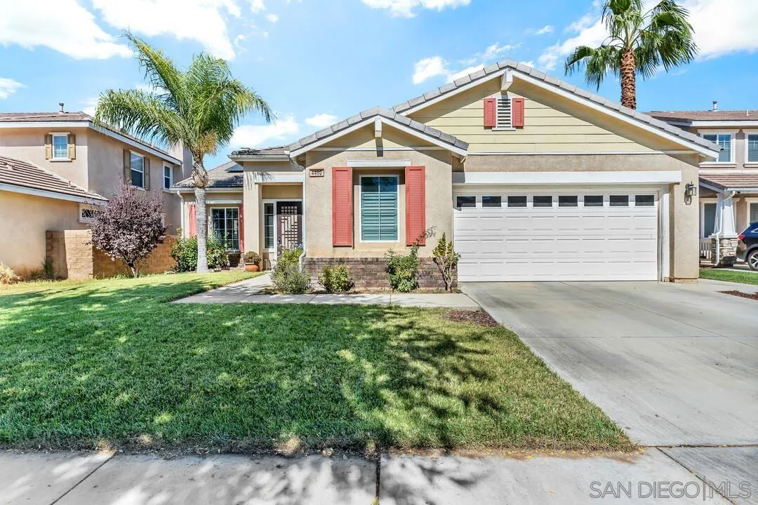 4460 Cloudywing Road Hemet, CA 92545 - Photo 1 of 41 a front view of a house with a garden and plants