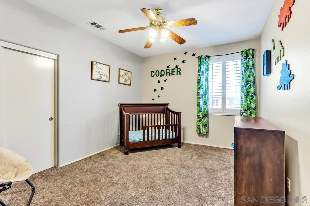 4460 Cloudywing Road Hemet, CA 92545 - Photo 22 of 41 a view of livingroom with a window and a ceiling fan