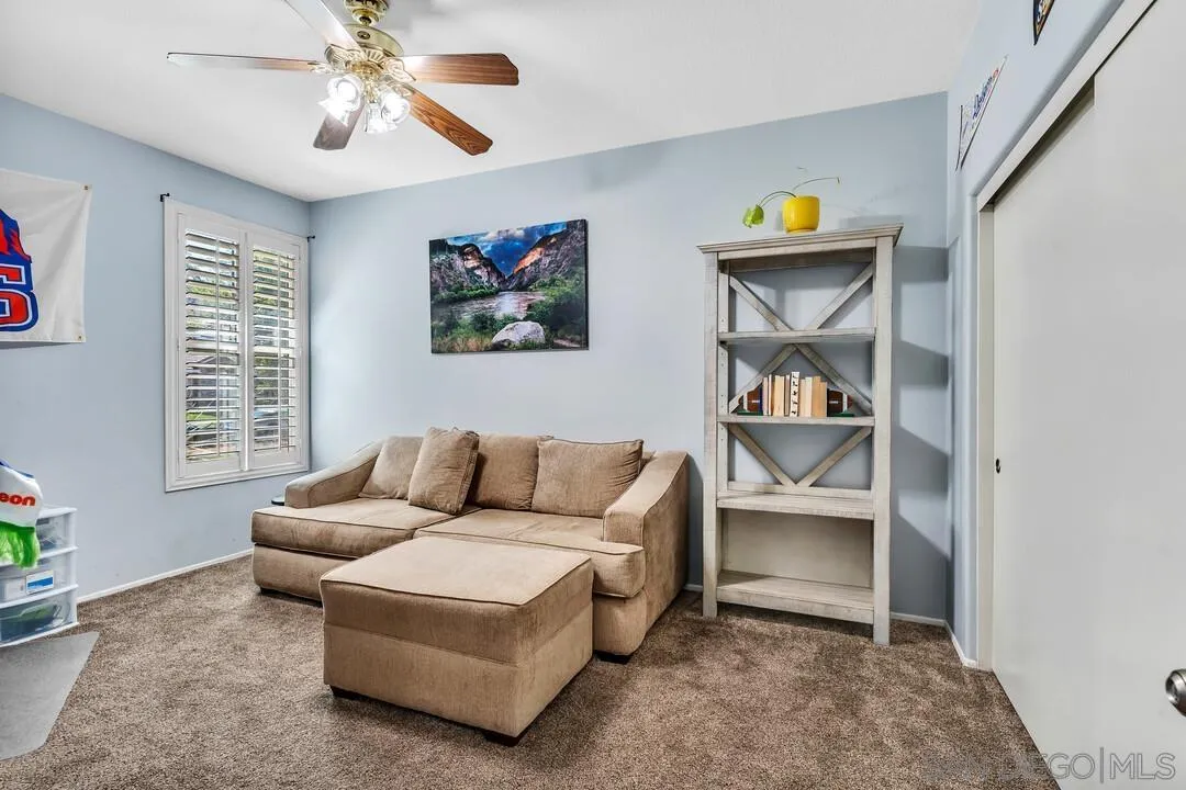 4460 Cloudywing Road Hemet, CA 92545 - Photo 26 of 41 a living room with furniture and a window