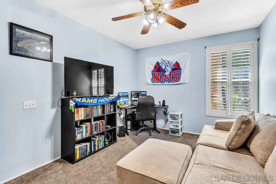 4460 Cloudywing Road Hemet, CA 92545 - Photo 27 of 41 a living room with furniture and a flat screen tv