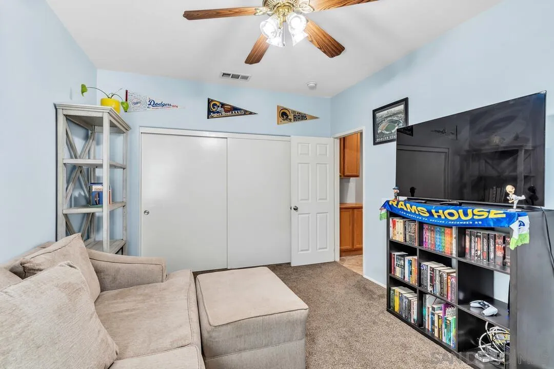 4460 Cloudywing Road Hemet, CA 92545 - Photo 28 of 41 a living room with furniture and a flat screen tv