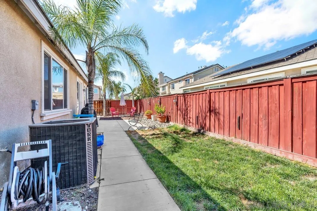 4460 Cloudywing Road Hemet, CA 92545 - Photo 31 of 41 a backyard of a house with barbeque oven table and chairs