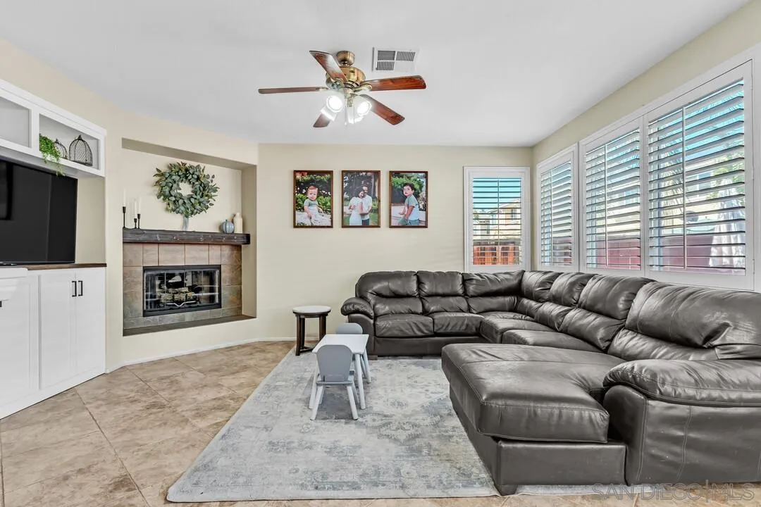 4460 Cloudywing Road Hemet, CA 92545 - Photo 9 of 41 a living room with furniture and a flat screen tv