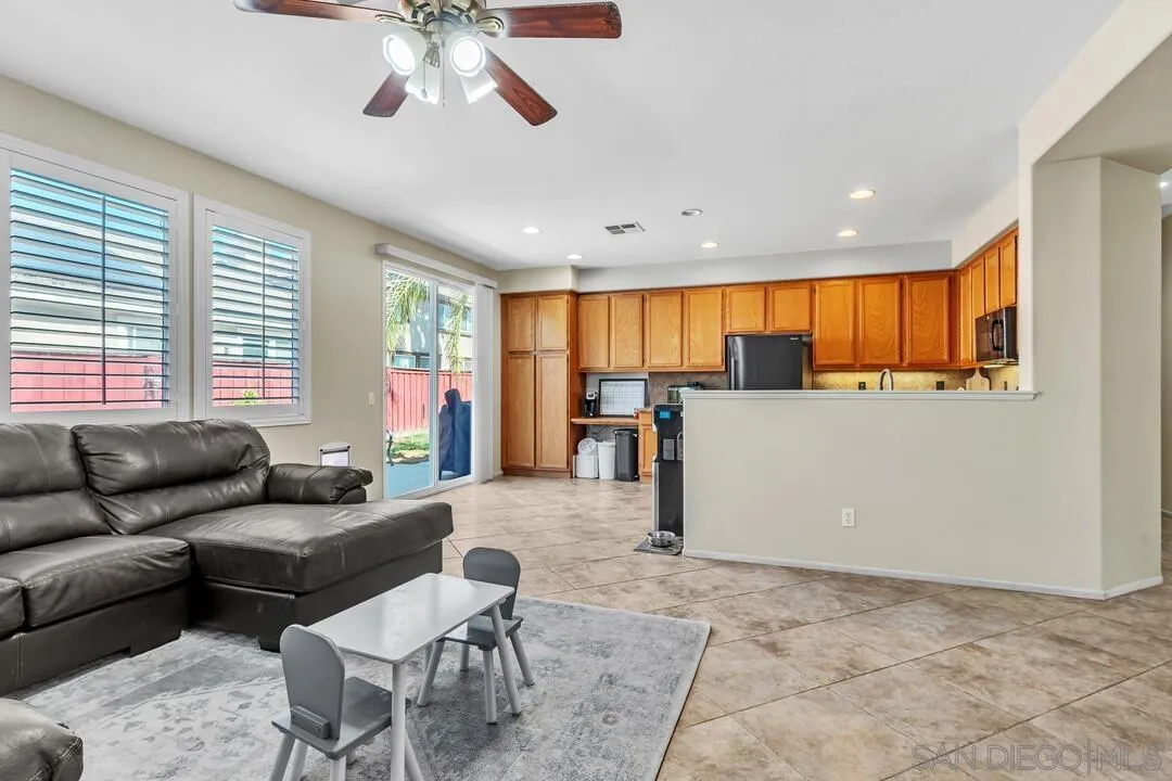 4460 Cloudywing Road Hemet, CA 92545 - Photo 10 of 41 a living room with furniture and kitchen view