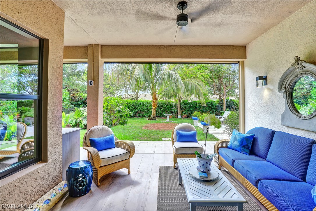 13772 Luna Drive Naples, FL 34109 - Photo 12 of 34 a outdoor living space with furniture and a garden