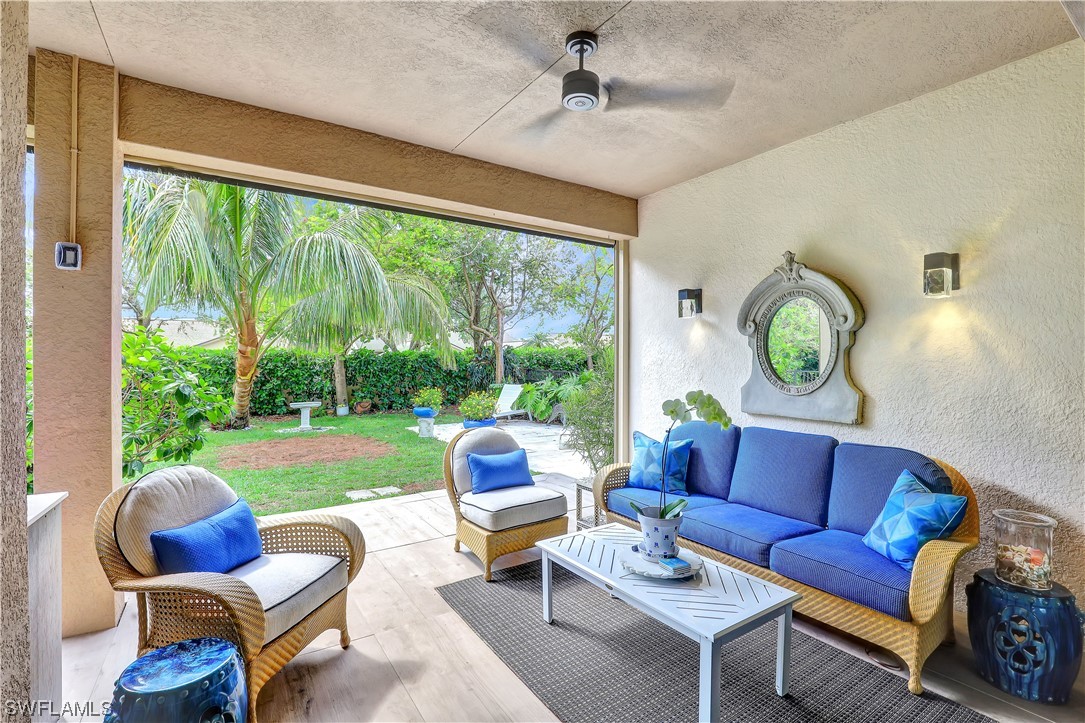 13772 Luna Drive Naples, FL 34109 - Photo 15 of 34 a living room with furniture and a large window