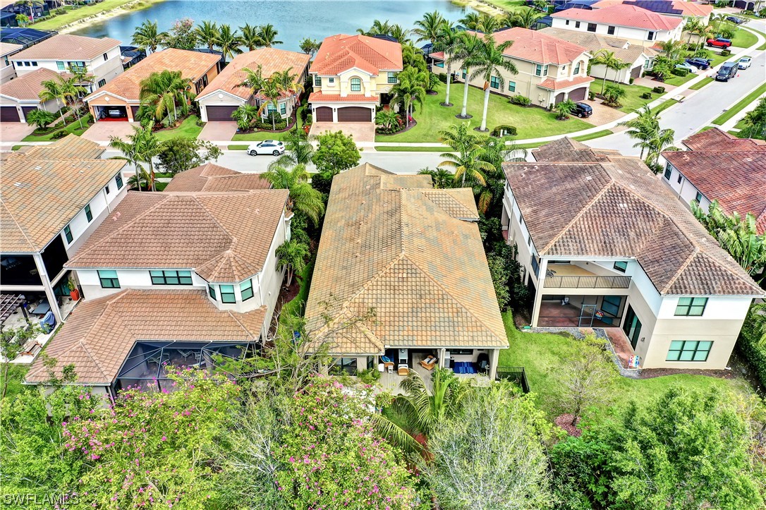 13772 Luna Drive Naples, FL 34109 - Photo 30 of 34 an aerial view of a house with yard and swimming pool