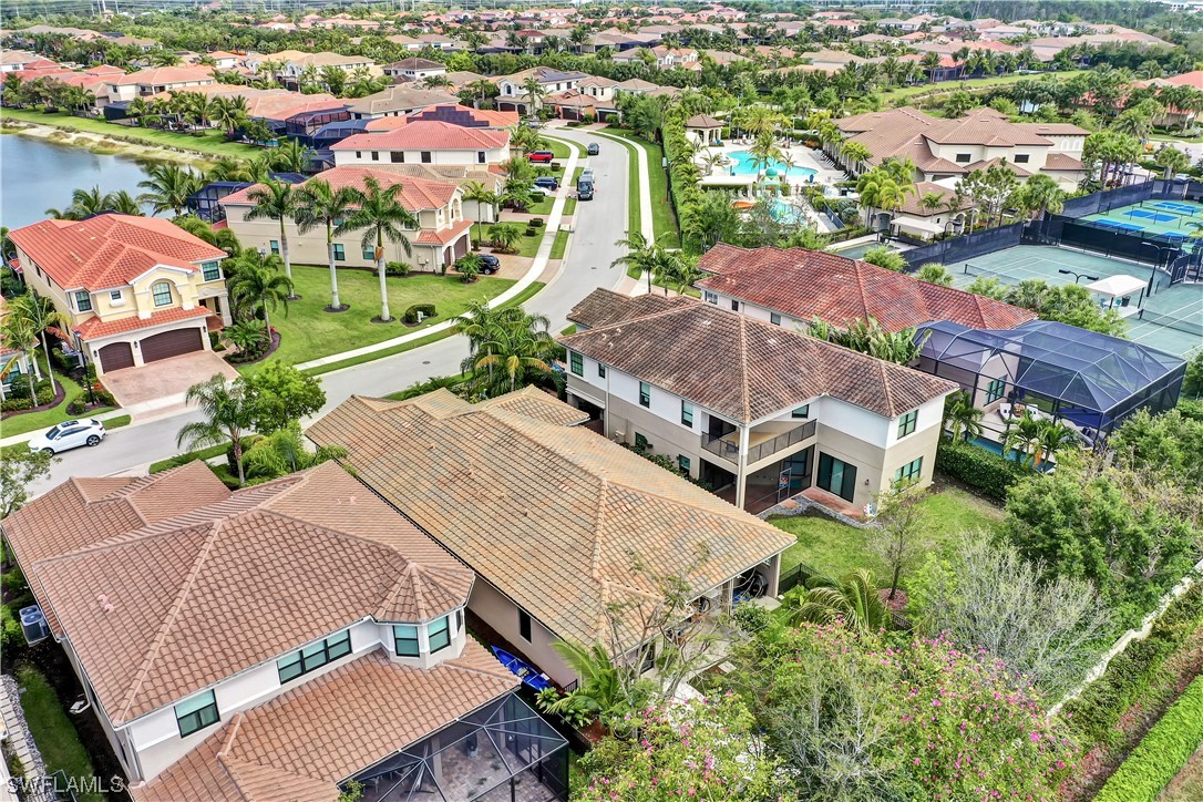 13772 Luna Drive Naples, FL 34109 - Photo 31 of 34 an aerial view of a house with outdoor space and lake view