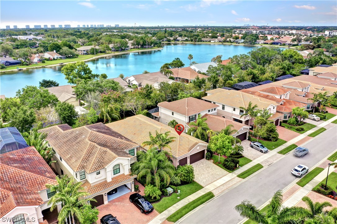 13772 Luna Drive Naples, FL 34109 - Photo 32 of 34 an aerial view of a houses with outdoor space and lake view