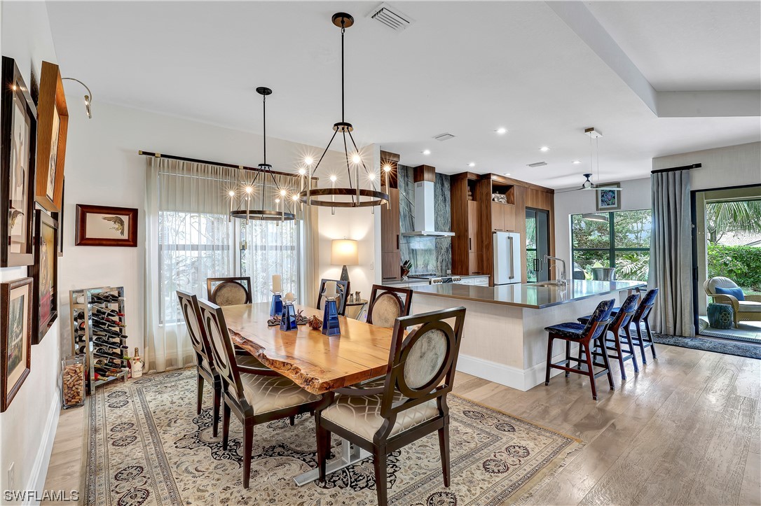 13772 Luna Drive Naples, FL 34109 - Photo 6 of 34 a view of a dining room with furniture window and outside view