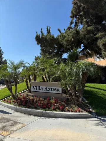 a sign that is sitting on a sidewalk