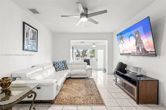 a living room with furniture and a rug