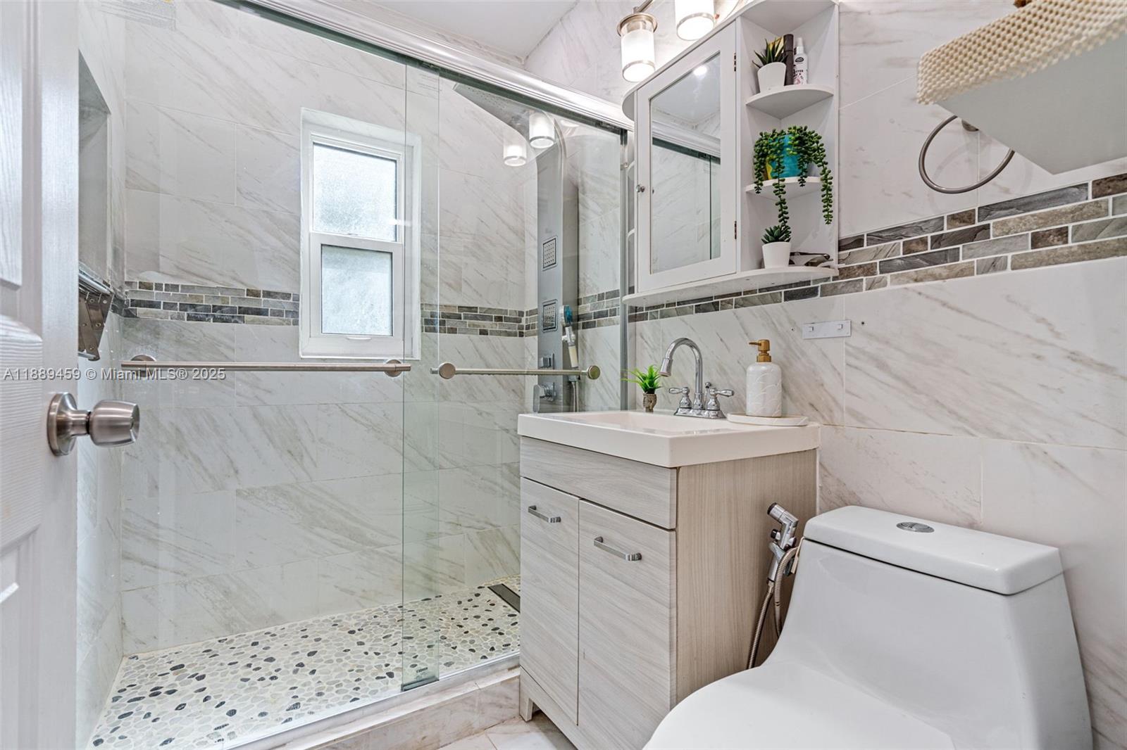 5340 Southwest 5th Street Miami, FL 33134 - Photo 20 of 43 a bathroom with a sink a toilet and shower